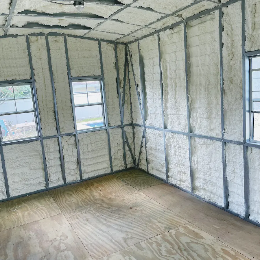 Closed-cell spray foam insulation applied to wall cavities in a residential project in East Windsor